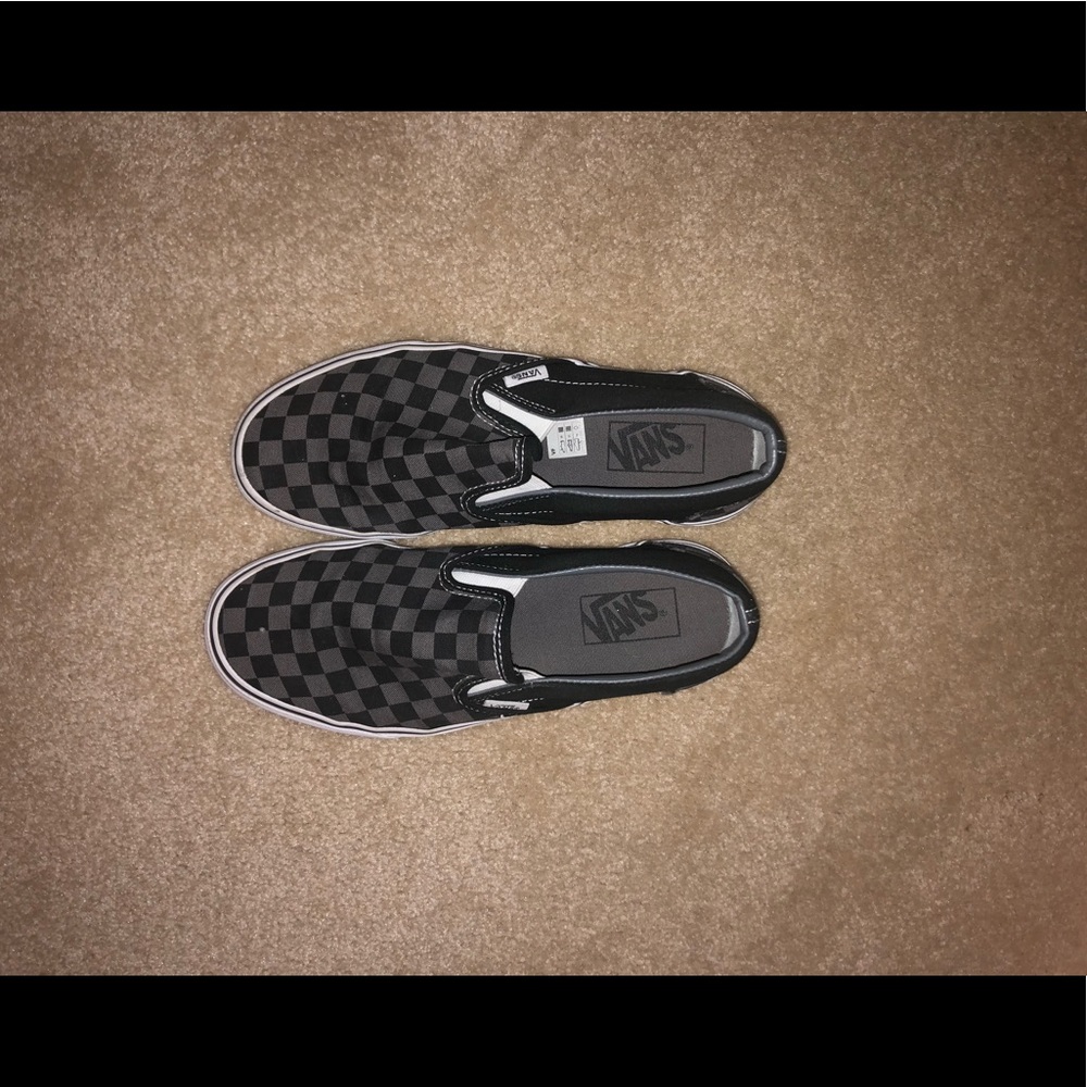 Black and grey checkered Vans